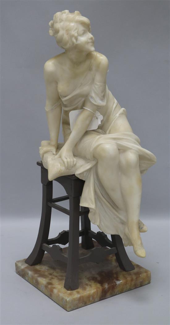 A 1930s alabaster seated model of a lady height 40cm